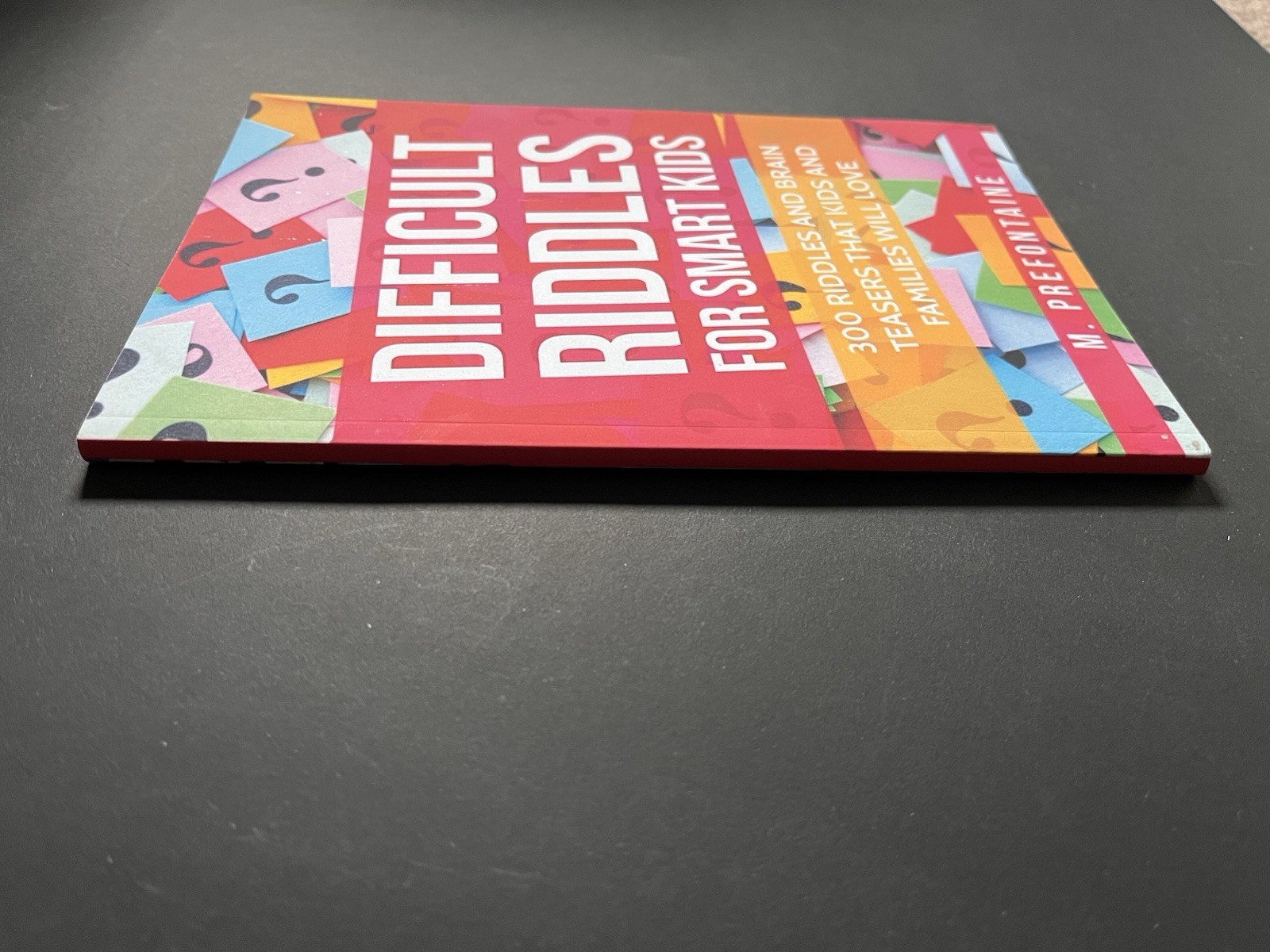 DIFFICULT RIDDLES FOR SMART KIDS Paperback Book by M. Prefontaine EUC