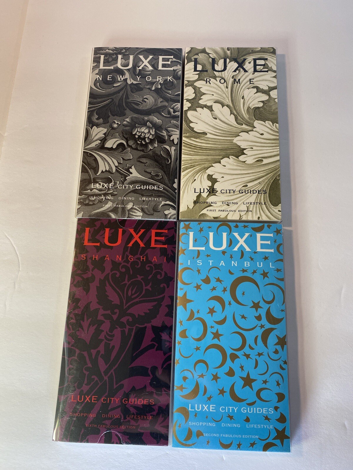 Luxe City Guides in Box, set of 12 in black flocked on white bkgd Travel Gift