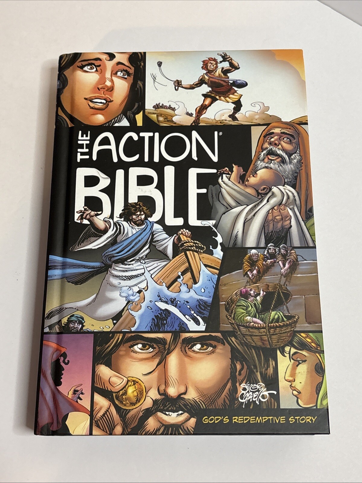 The Action Bible: God&rsquo;s Redemptive Story by Sergio Cariello Hardcover