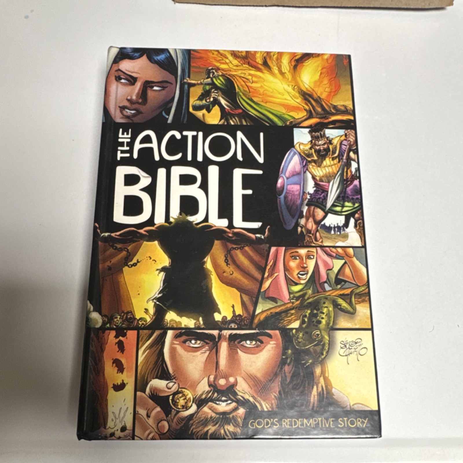 The Action Bible: God&rsquo;s Redemptive Story by Doug Mauss HC 2010 Illus Cariello